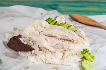 sliced Hainan-style chicken with marinated rice in