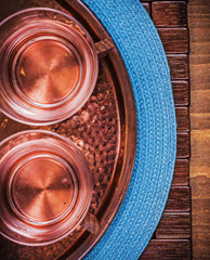Table cloth coppery tray tea cups food and drink concept