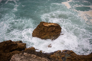 Wave crashing on a coast in Nazare