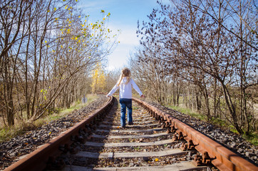 Fototapeta na wymiar child standing in railway