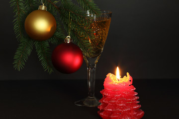 advent candle and glass of champagne