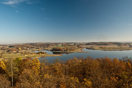 autumn panorama of Pohl water reservoir with autumn countryside around and clear sky near Plauen in Saxony
