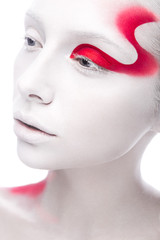 Obraz premium Art fashion girl with white skin and red paint on the face. Creative art beauty