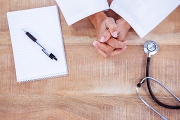 View of doctor with hands crossed 