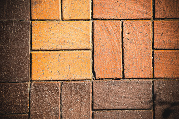 Fragment of red brick wall for background. Toned