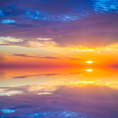 Beautiful colorful sunset over mediterranean sea is reflected in