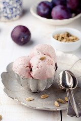 Plum ice cream with cardamon seeds. White background. 