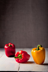 Bell peppers fresh on a wooden background 