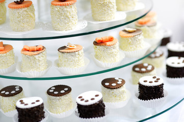 Decorated cupcakes on a glass plate
