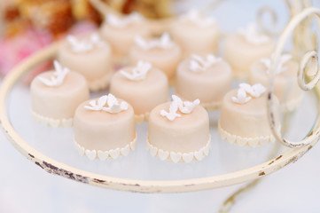 Decorated cupcakes on a glass plate