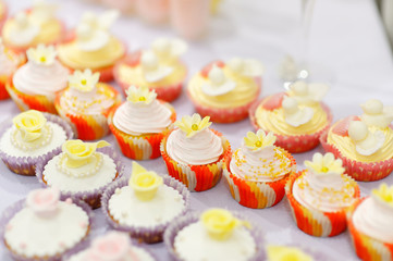 Decorated cupcakes on a white table