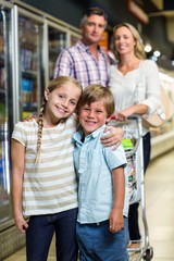 Happy family at the supermarket