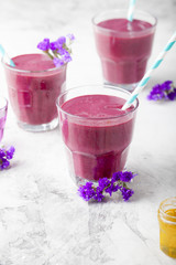 Blueberry, blackberry, honeysuckle, honeyberry smoothie with violet syrup and acai. 