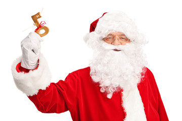 Santa Claus holding a key wrapped with red ribbon