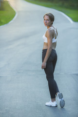 Fototapeta premium young woman stopped while jogging