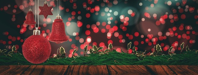 Composite image of red christmas bell decoration hanging  - Powered by Adobe