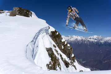 flying snowboarder on mountains