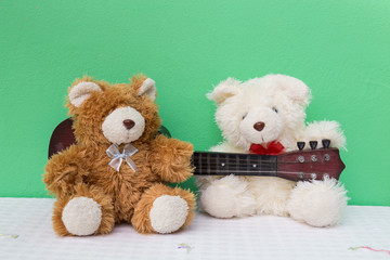 Two teddy with guitar. Concept about love and relationship