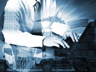 Double exposure of success businessman using computer with container truck ,ship in port and...