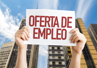 Employment Offer (in Spanish) placard with urban background