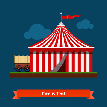Open circus striped tent with wagon wheel