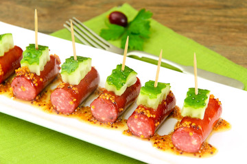 Cocktail Sausage and Cucumber on Plate.