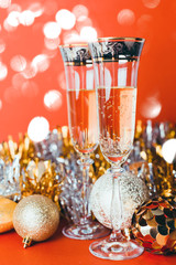 Champagne and new year decoration on golden background