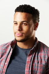 Studio Portrait Of Man Against White Background