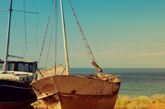 Boat framework on a beach against the sea in Greece. Old Fisherman Boat