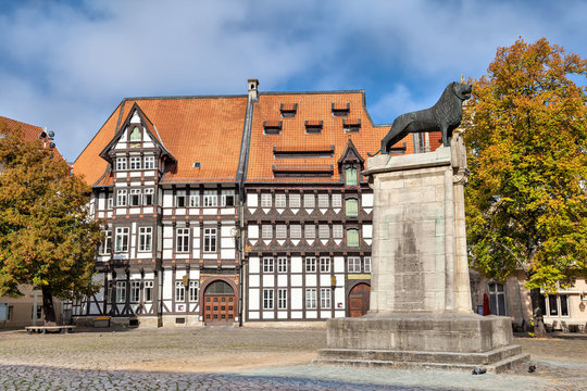 Half-timbered building and statue of Leon in Braunschweig
