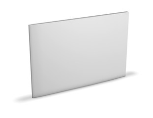 Rectangular booklet with blank cover standing on floor.