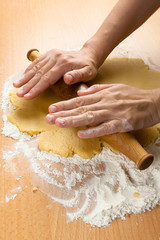 hand rolling dough for cookies, closeup