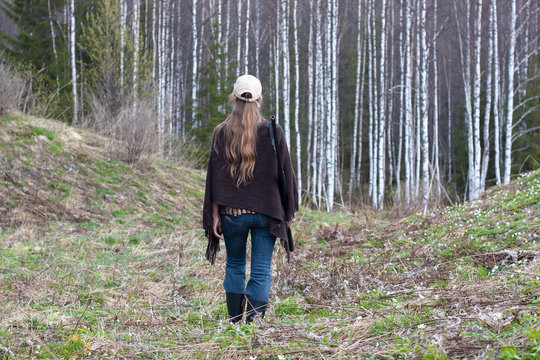 Woman hunter walking in the forest