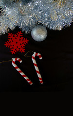 Christmas decoration composition tinsel snowflake bauble and candy cane