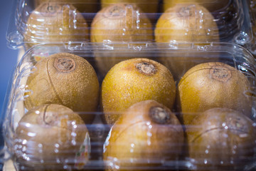Many kiwi fruit in transparent plastic