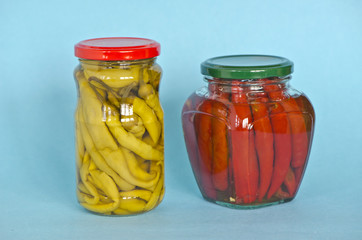 Vegetables peppers preserved in two glass jars
