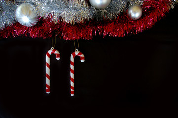 Christmas decoration composition tinsel candy canes and baubles