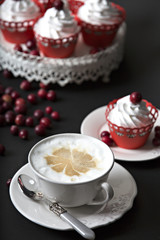 offe and cupcake with cream and cranberries