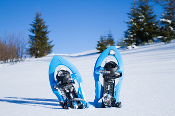Snowshoeing. Snowshoes in the snow.