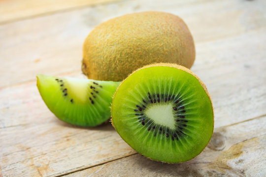 Fresh kiwi fruits on wooden table