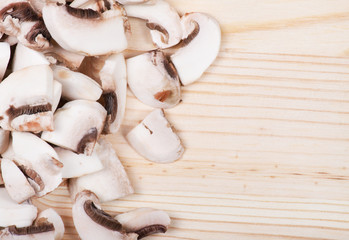 Many mushrooms on wooden table