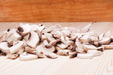 Many mushrooms on wooden table