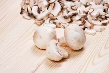 Many mushrooms on wooden table
