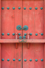 Red gate with a bar