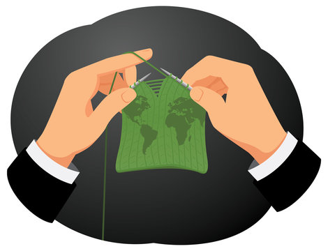 Businessman hands are knitting a wool map. Creation of the financial world.