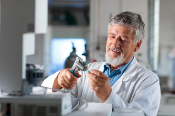 Senior chemistry professor/doctor in a lab