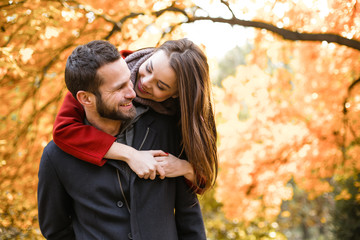 Fototapeta premium Nice concept for young couple in autumn park