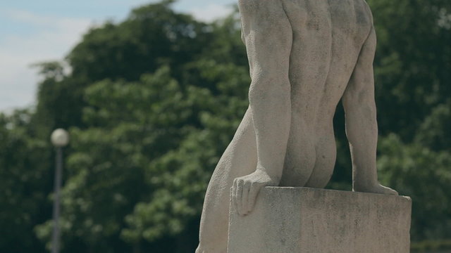 Statue of man at the Trocadero looking at the Eiffle Tower