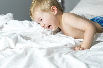 Healthy Lifestyle of young little children boy on bed