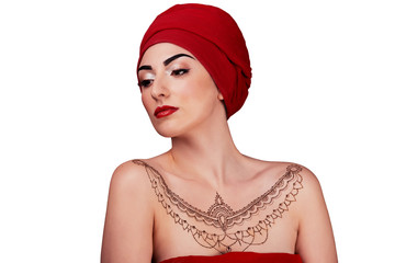 Arabic tanned girl in a red scarf, henna tattoo. isolated white